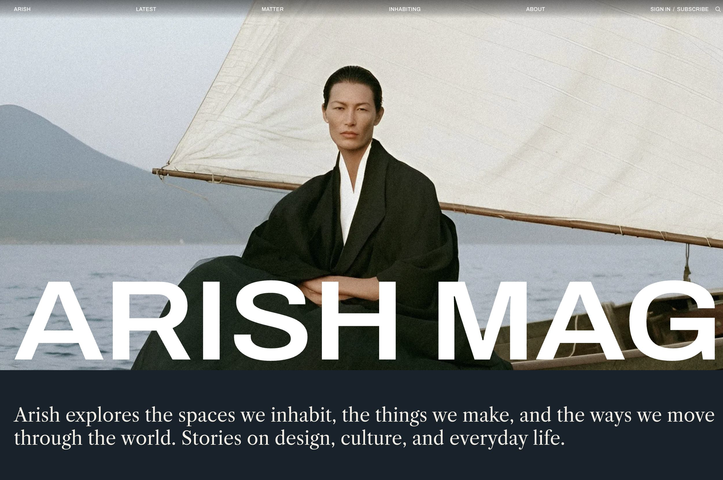 Arish magazine homepage in the Ink color scheme, with navigation over a full-screen portrait and a dark introduction below.
