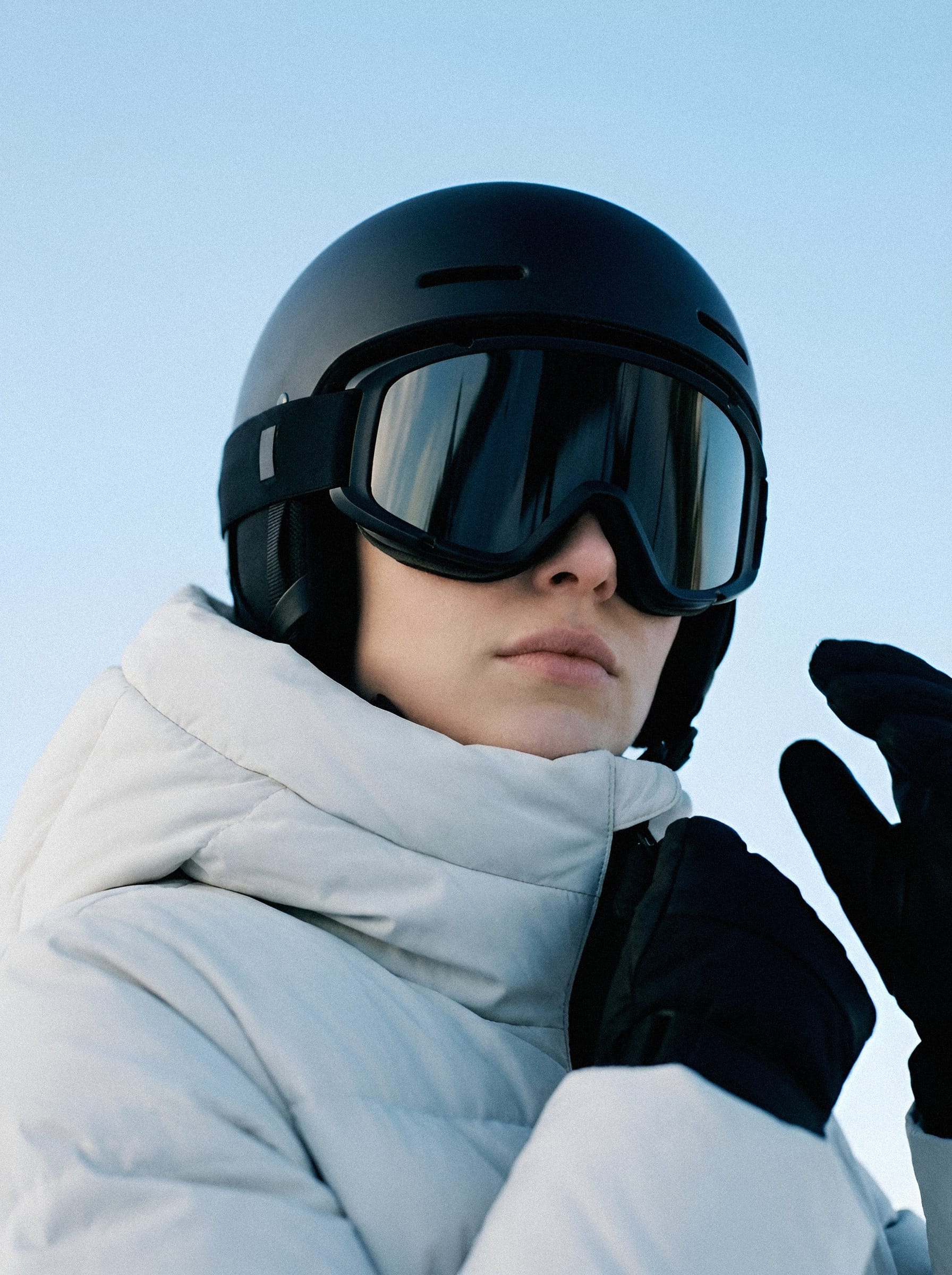 Skier in white puffy jacket.
