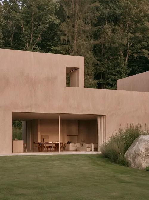 Pink modernist house with lawn.